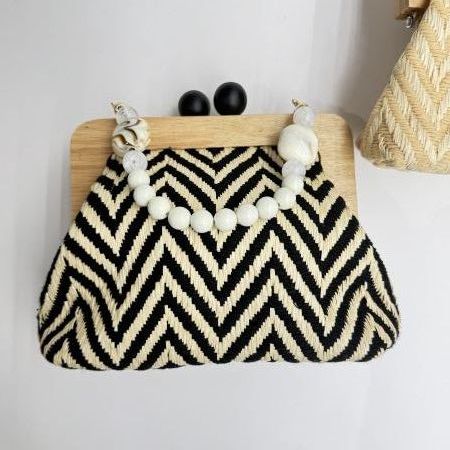 Rectangular-shaped bag with rigid handle for women